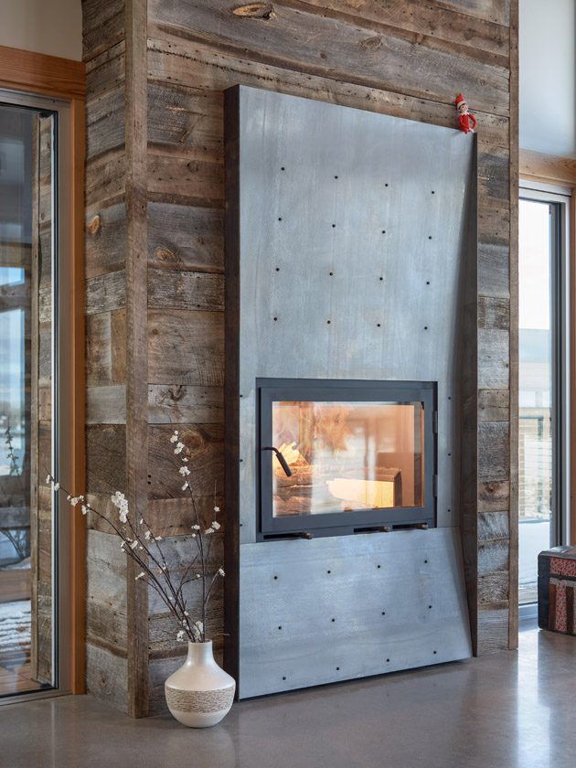 modern steel barn wood fireplace