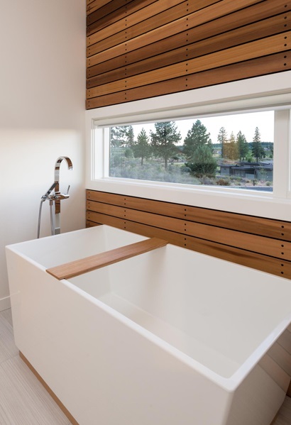 modern soaking tub with a view